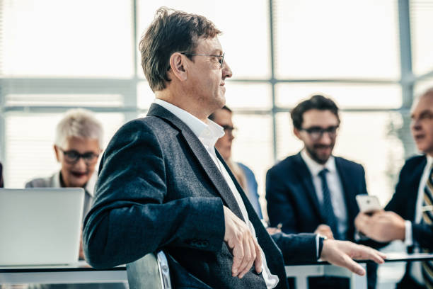 istock smiling young businessman sitting at an office Desk 1288582780