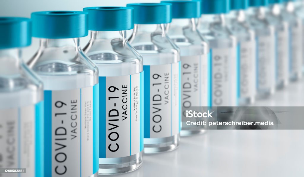 Close-up of bottles of COVID-19 vaccine Row Covid-19 or Coronavirus vaccine flasks on white background Vaccination Stock Photo