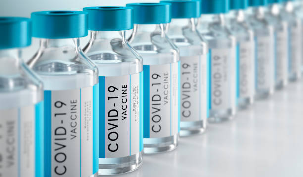 Close-up of bottles of COVID-19 vaccine Row Covid-19 or Coronavirus vaccine flasks on white background covid 19 stock pictures, royalty-free photos & images