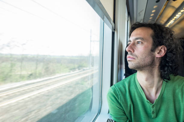 istock young man traveling on a train 1288584050