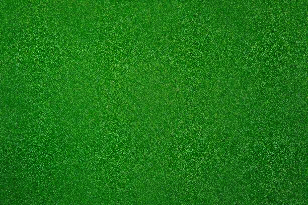 istock Green giltter texture abstract background. Shiny wrapper paper. 1288584756