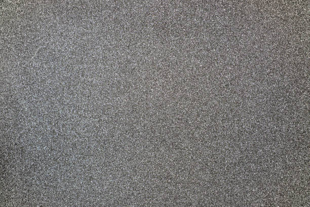istock Gray giltter texture abstract background. Shiny wrapper paper. 1288584837
