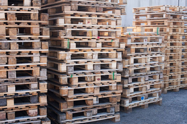 istock Pallet - wooden shipping container, grounds for collection, storage, transshipment and transportation of goods 1288586260