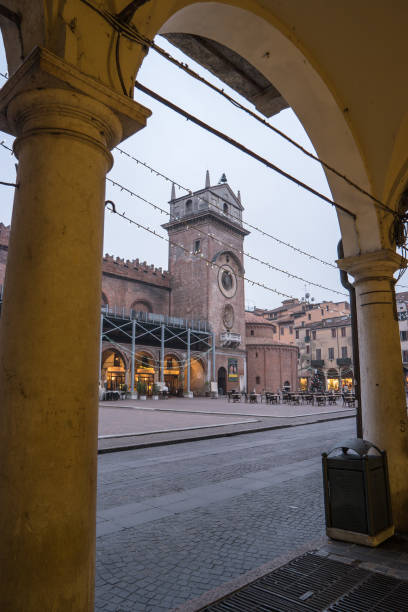 The Clock Tower and The church of the Rotonda San Lorenzo, Piazza delle Erbe, Mantua, Italy Mantua, Lombardy, Italy, December 2015: The Clock Tower and The church of the Rotonda San Lorenzo located in Piazza delle Erbe, during the Christmas Time. san lorenzo rome photos stock pictures, royalty-free photos & images