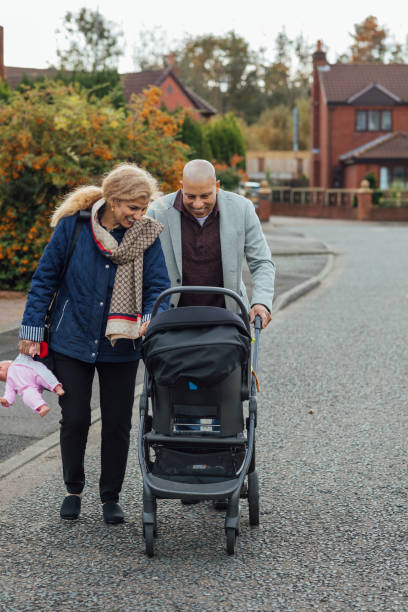 istock Grandparents Pushing a Pushchair 1288590042