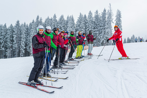 2016-12-19 Bukovel, Ukraine. Students and teacher of ski school. Winter outdoor activity in Ukraine