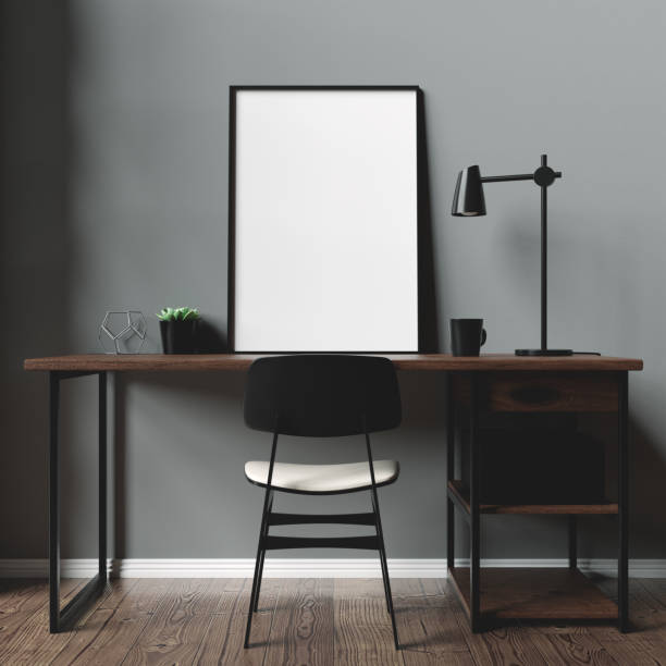 istock A2 Black Mockup Frame positioned on an office desk 1288591312