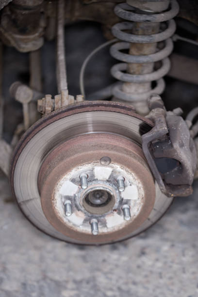 istock Rear car strut, wheel hub, brake assembly, selective focus 1288592590