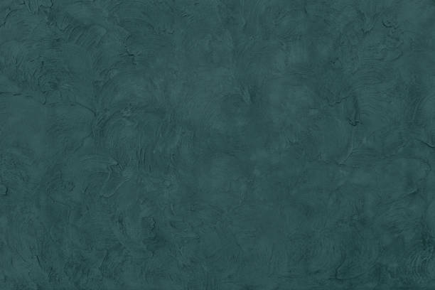 dark green colored low contrast concrete textured background