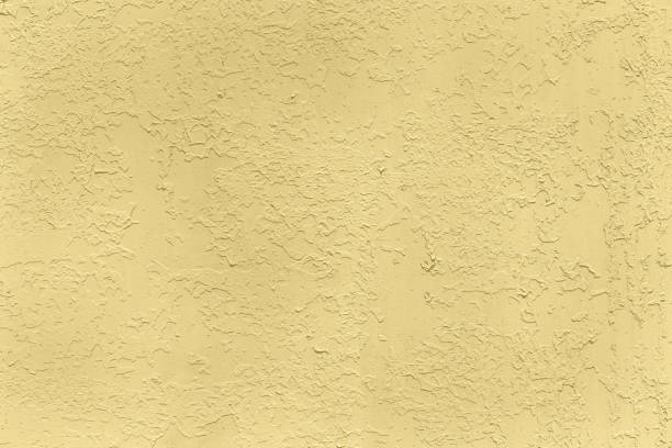 istock Pastel colored yellow low contrast Concrete textured background 1288593338