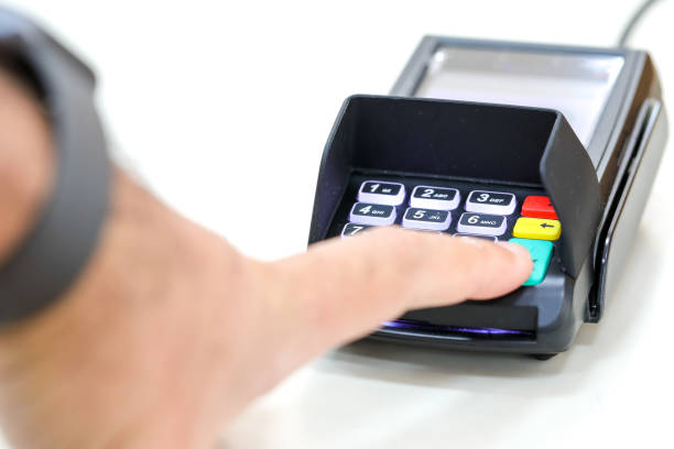 istock Finger clicks on a transaction confirmation at a credit card payment terminal. 1288594800