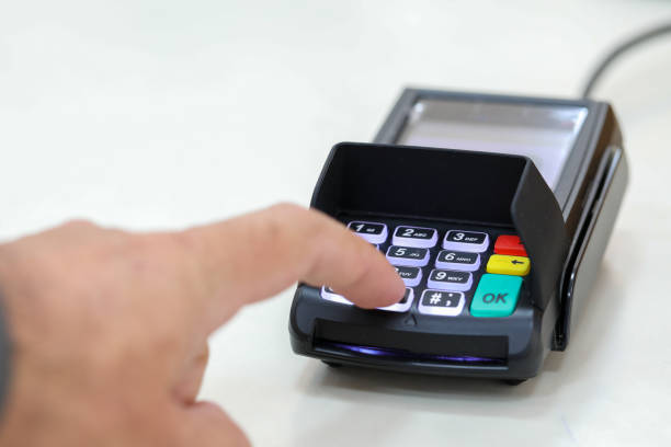 istock Finger clicks on a transaction confirmation at a credit card payment terminal. 1288594877