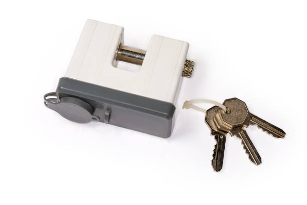 istock Padlock with rod sliding to the side to unlock and keys 1288596519