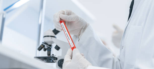 istock close up. laboratory employee sitting at the laboratory table 1288600945