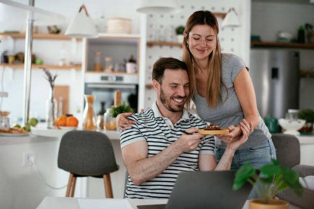 istock Wife surprise her husband with birthday cake 1288601032
