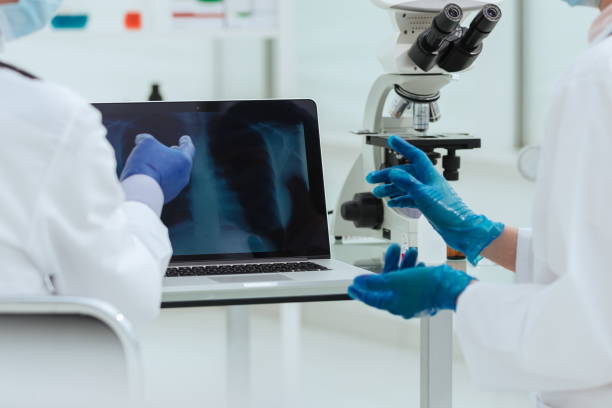 istock close up. attending doctors discussing x-rays in the laboratory 1288601063