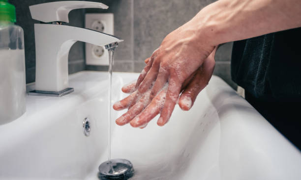 istock close up. young man is carefully soaping his hands 1288601710