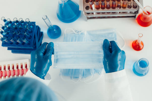 istock close up. protective mask in the hands of an epidemiologist 1288601933