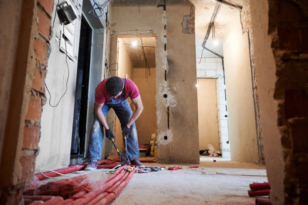 istock Young plumber installing underfloor heating system in new apartment 1288603224