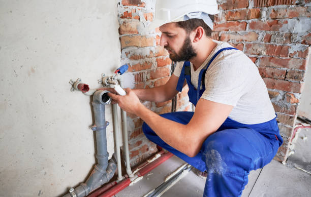 istock Young plumber working with sealant fix of sewer pipe 1288603281