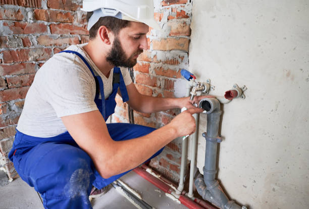 istock Young plumber working with sealant fix of sewer pipe 1288603285