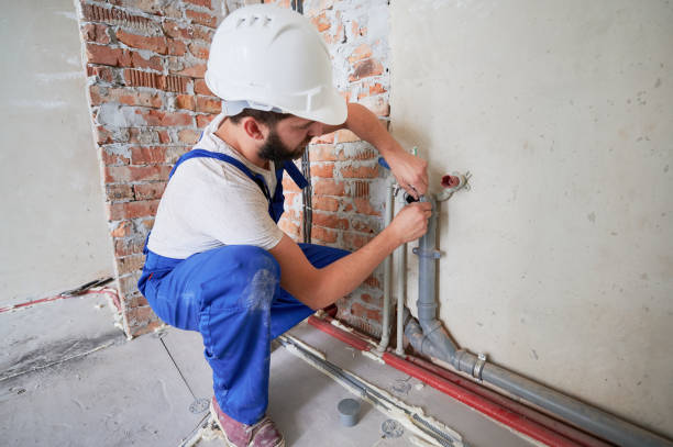 istock Male plumber applying silicone grease on pipe. 1288603289