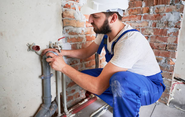 istock Young plumber working with sealant fix of sewer pipe 1288603290