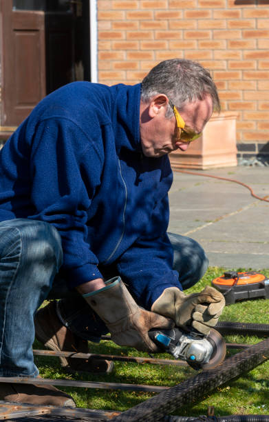 istock Senior man cutting a garden table up 1288603443