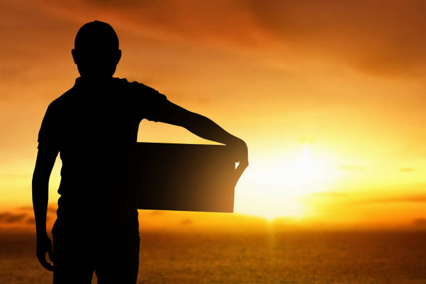 istock Silhouette of delivery man at sunset 1288604203