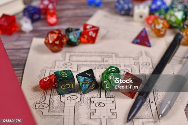 Colorful Tabletop Role Playing Rpg Game Dices On Hand Drawn Dungeon Map Stock Photo - Download Image Now