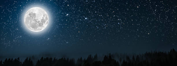 istock mountain. backgrounds night sky with stars and moon and clouds. 1288605098