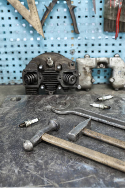istock Motorist's workplace. Old tools set on metallic table with tools and motorparts 1288606500