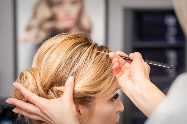 istock Woman receiving her hair done 1288607401