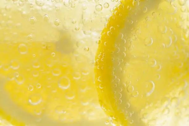 Sliced lemon in carbonated water
