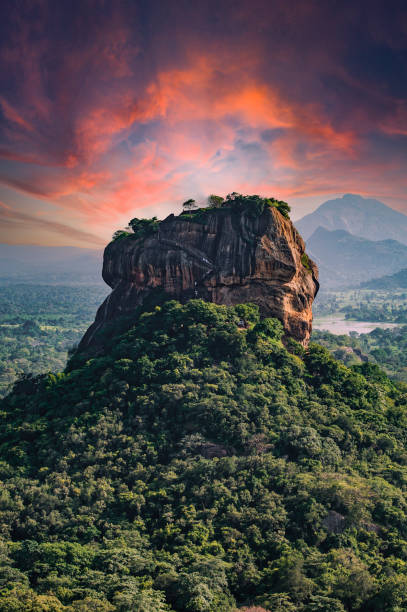 Spectacular view of the Lion rock surrounded by green rich vegetation. Picture taken from Pidurangala Rock in Sigiriya, Sri Lanka. stock photo