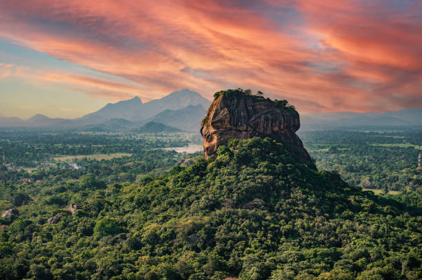 Spectacular view of the Lion rock surrounded by green rich vegetation. Picture taken from Pidurangala Rock in Sigiriya, Sri Lanka. stock photo