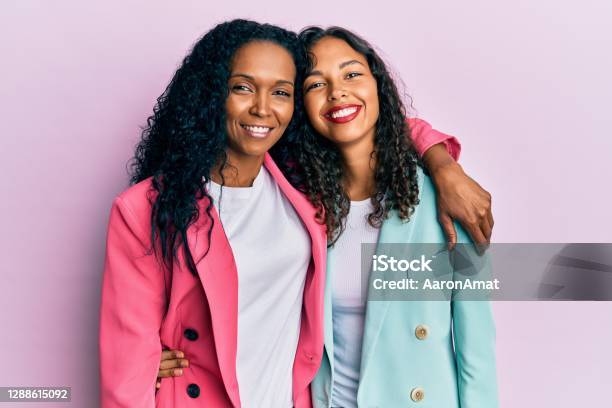 African American Mother And Daughter Wearing Business Style With A Happy And Cool Smile On Face Lucky Person Stock Photo - Download Image Now