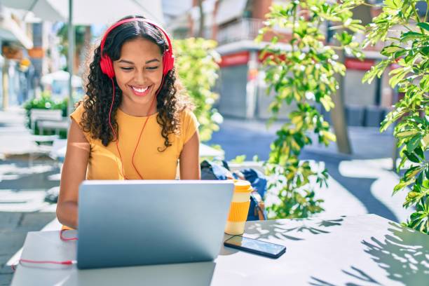 young african american student girl using laptop sitting on the table at terrace. - happiness student cheerful lifestyle imagens e fotografias de stock