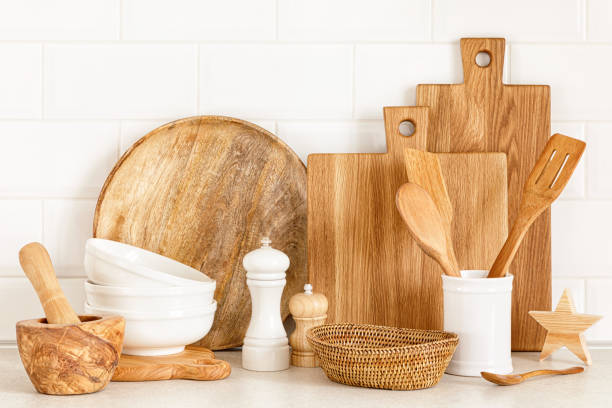 istock Kitchen utensils on countertop, culinary background, wooden and white ceramic kitchenware, home cooking concept 1288624013