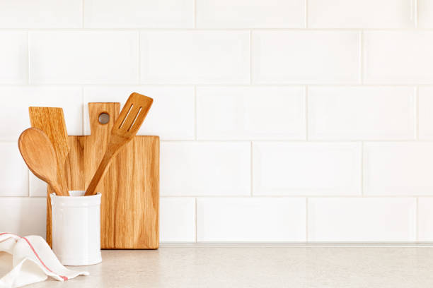 Kitchen utensils on countertop, culinary background, wooden and white ceramic kitchenware, home cooking concept