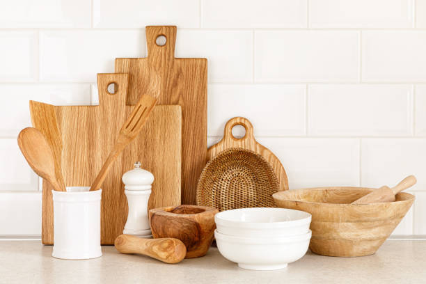 istock Kitchen utensils on countertop, culinary background, wooden and white ceramic kitchenware, home cooking concept 1288625056