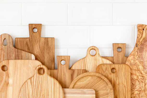 istock Kitchen utensils on countertop, culinary background, wooden and white ceramic kitchenware, home cooking concept 1288625064