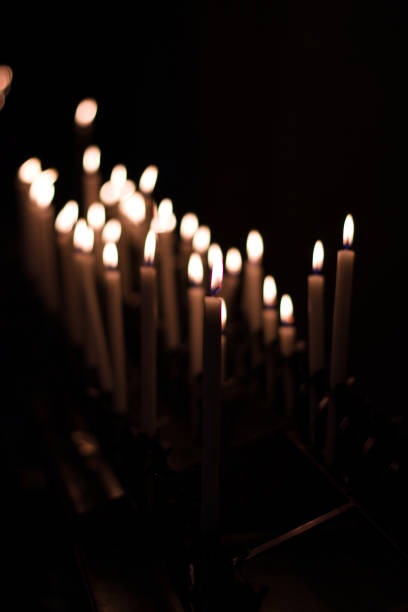 istock Candles lit in church in Italy. 1288626547