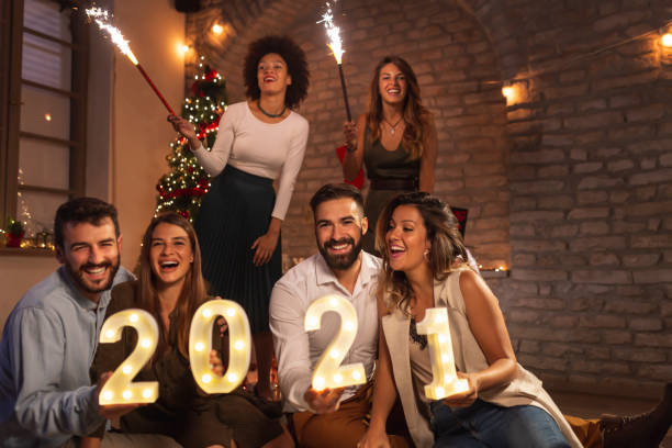 istock Friends having fun at New Year's party midnight countdown 1288627073