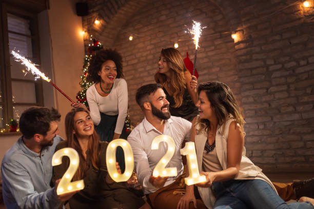 istock Friends celebrating New 2021 Year at home 1288627211