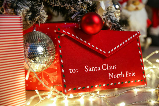 istock an envelope to santa claus under the christmas tree 1288630269