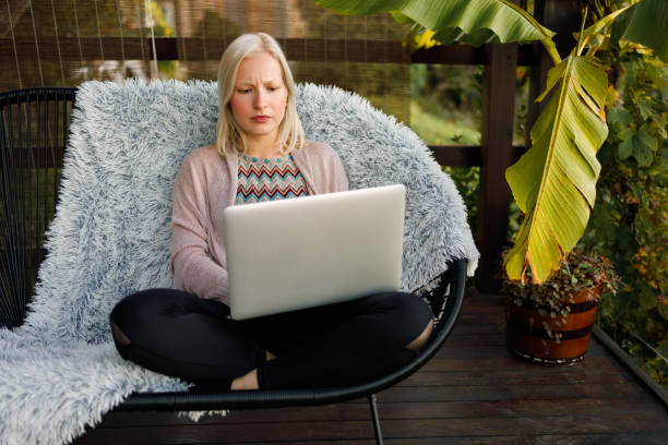 istock Young woman working from home 1288632419