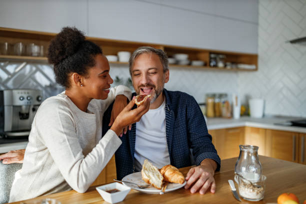 istock Eating breakfast together, croissants and jam. 1288632749