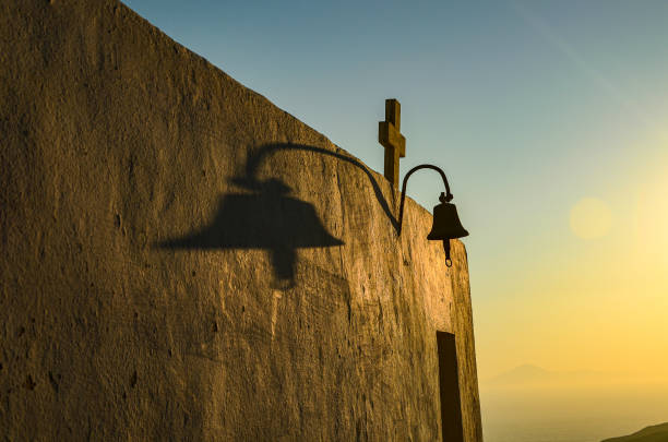 Bell under church's cross in Anafi