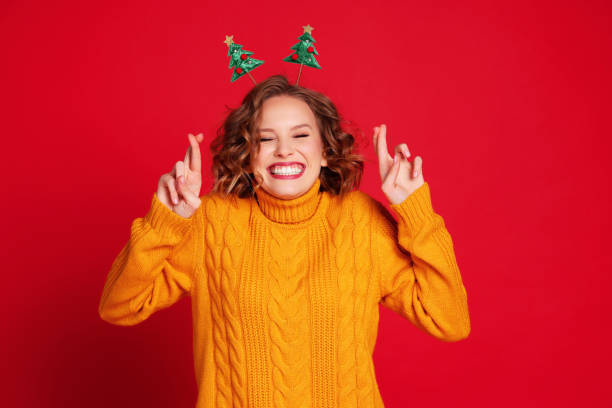 istock Excited woman making Christmas wish 1288636648